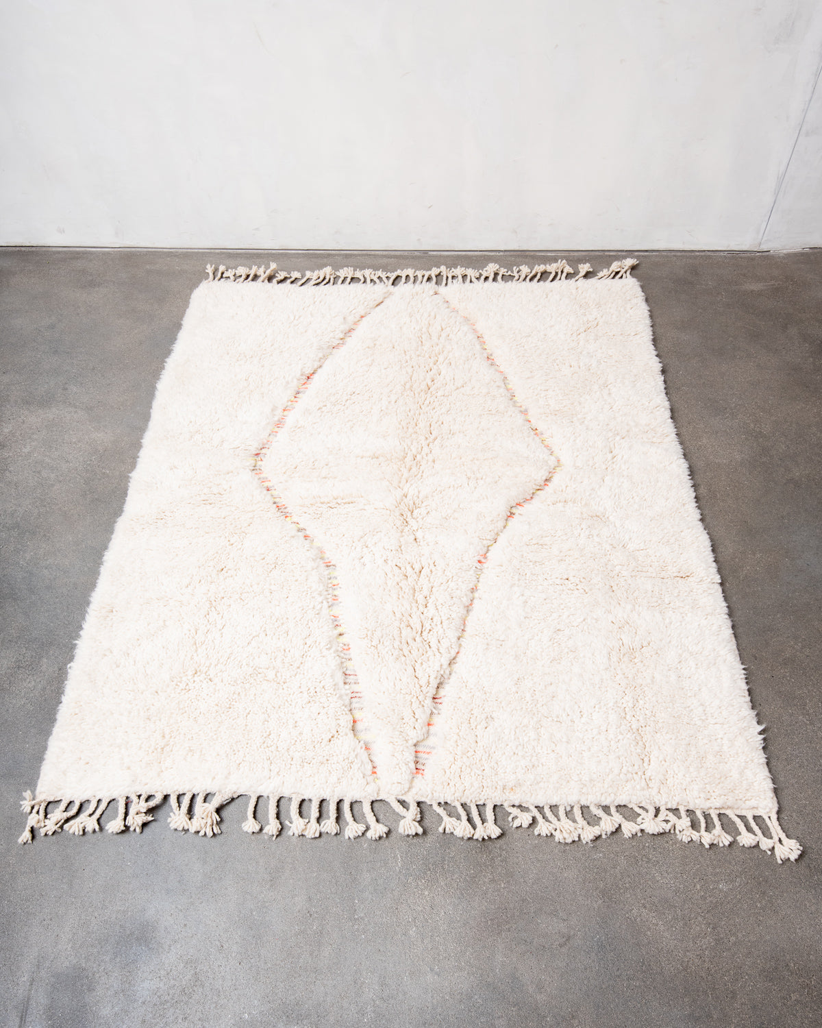 Modern, designer, handcrafted Berber rug from Morocco. Beniourain carpet with beautiful colours and patterns and fluffy wool texture.